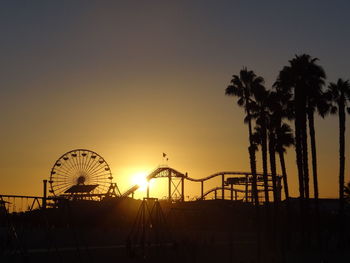 Pacific park silhouette at sunset, santa monica pier, california, usa