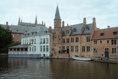 View of buildings against cloudy sky