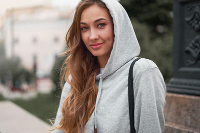 Portrait of woman smiling standing outdoors