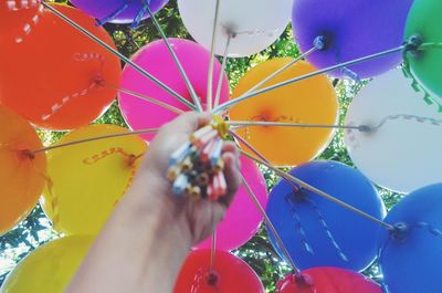 Low angle view of multi colored balloons