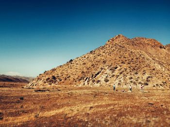 Scenic view of landscape against clear blue sky