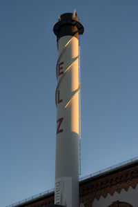 Low angle view of lighthouse against clear sky