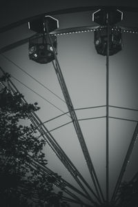 Low angle view of power cables against sky