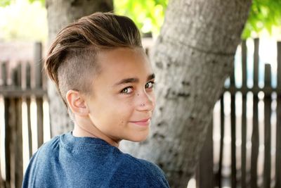 Portrait of boy standing outdoors