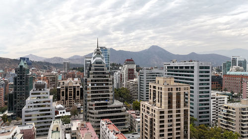 Buildings in city against sky