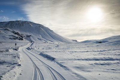 Scenic view of snowcapped mountains against sky