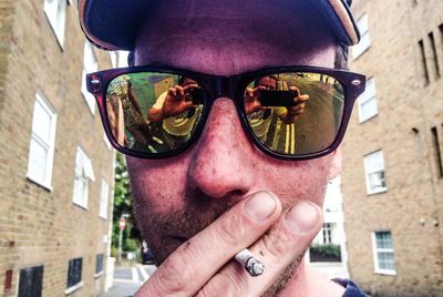 Close-up of man smoking cigarette