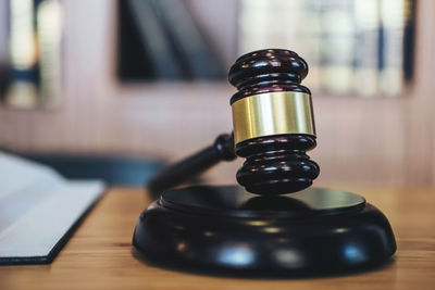 Close-up of gavel on desk