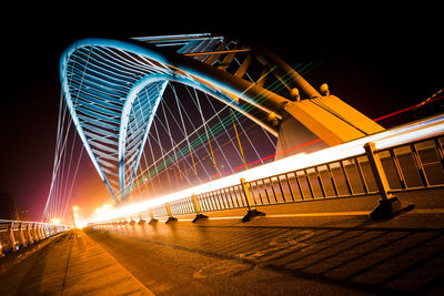 Illuminated ferris wheel at night