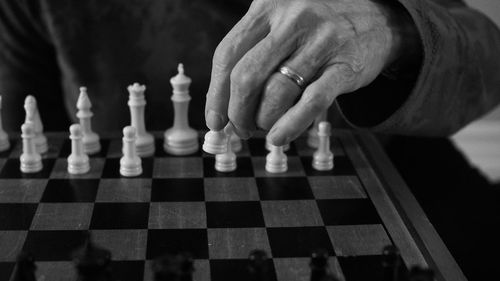 Low angle view of man playing on chess board