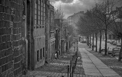 Street amidst buildings against sky