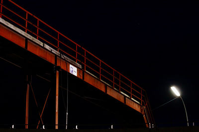 Low angle view of train against sky at night