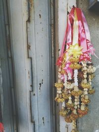 Close-up of pink flowers hanging on clothesline