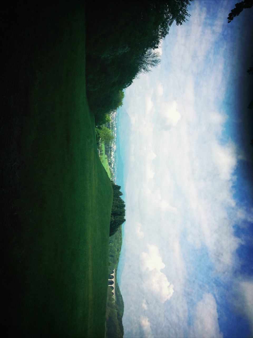 sky, tranquil scene, tranquility, mountain, scenics, landscape, beauty in nature, cloud - sky, nature, cloud, cloudy, non-urban scene, grass, field, tree, idyllic, remote, day, outdoors, hill