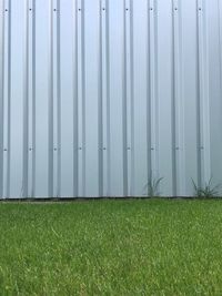 Scenic view of field seen through fence