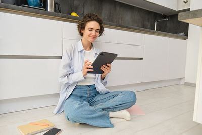 Young man using digital tablet