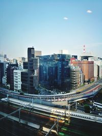 High angle view of buildings in city against sky