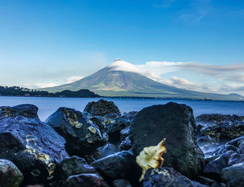 Scenic view of sea and rocks against sky