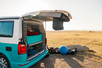 Camper van parked near the sea in almeria, spain, with vacation objects