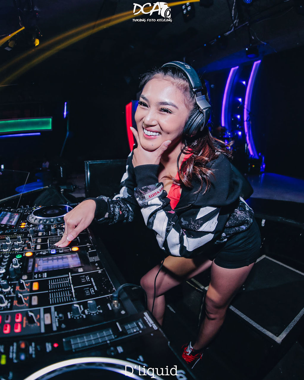 music, one person, arts culture and entertainment, adult, dj, technology, enjoyment, women, headphones, event, night, happiness, audio equipment, occupation, young adult, performance, listening, emotion, indoors, nightlife, smiling, sound mixer, nightclub, sound recording equipment, musician, cheerful, portrait