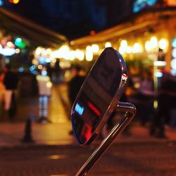 Illuminated lamp post at night