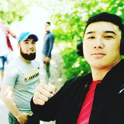 Portrait of young couple standing outdoors