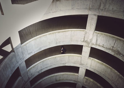 High angle view of man walking at parking lot