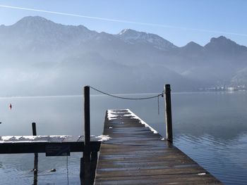 Pier over lake against sky