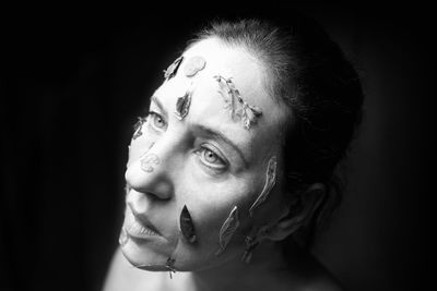 Woman.s face with dry flowers in black and white
