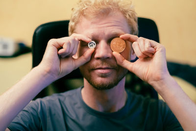 Close-up of woman holding heart shape