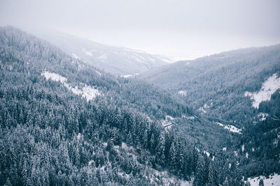 Scenic view of mountains against sky during winter