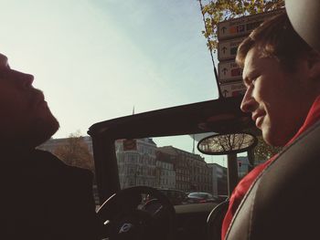 Woman looking at city street