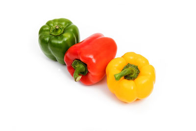 Close-up of bell peppers against white background