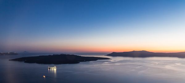 Scenic view of sea against clear sky during sunset