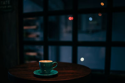 Close-up of coffee cup on table