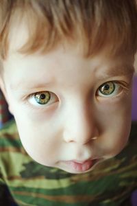 Huge eyes of a child. big green eyes. scared look