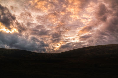 Scenic view of dramatic sky during sunset