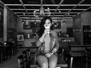 Young woman sitting on chair