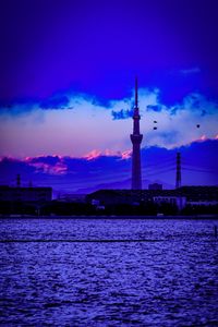 View of tower against cloudy sky