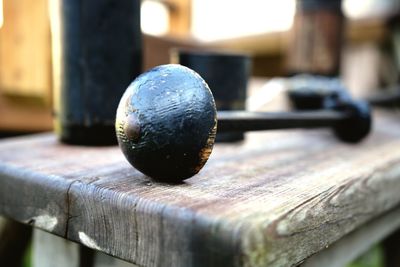 Close-up of metal ball on wood