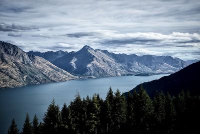 Scenic view of lake and mountains against sky