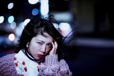 Portrait of smiling girl at night