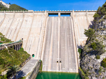 High angle view of dam by river against sky