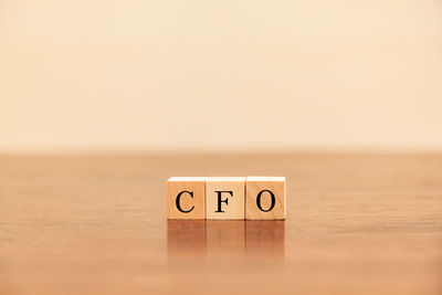 Close-up of text on wooden wall