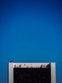 Low angle view of building against blue sky