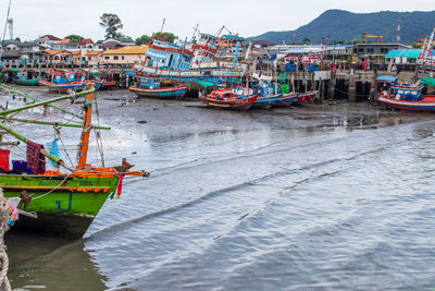 Fishing boats moored at harbor