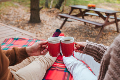 Rear view of woman holding coffee cup