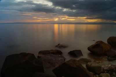 Scenic view of sea against sky at sunset