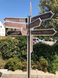 Information sign against trees and plants