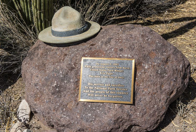 High angle view of text on stone at cemetery
